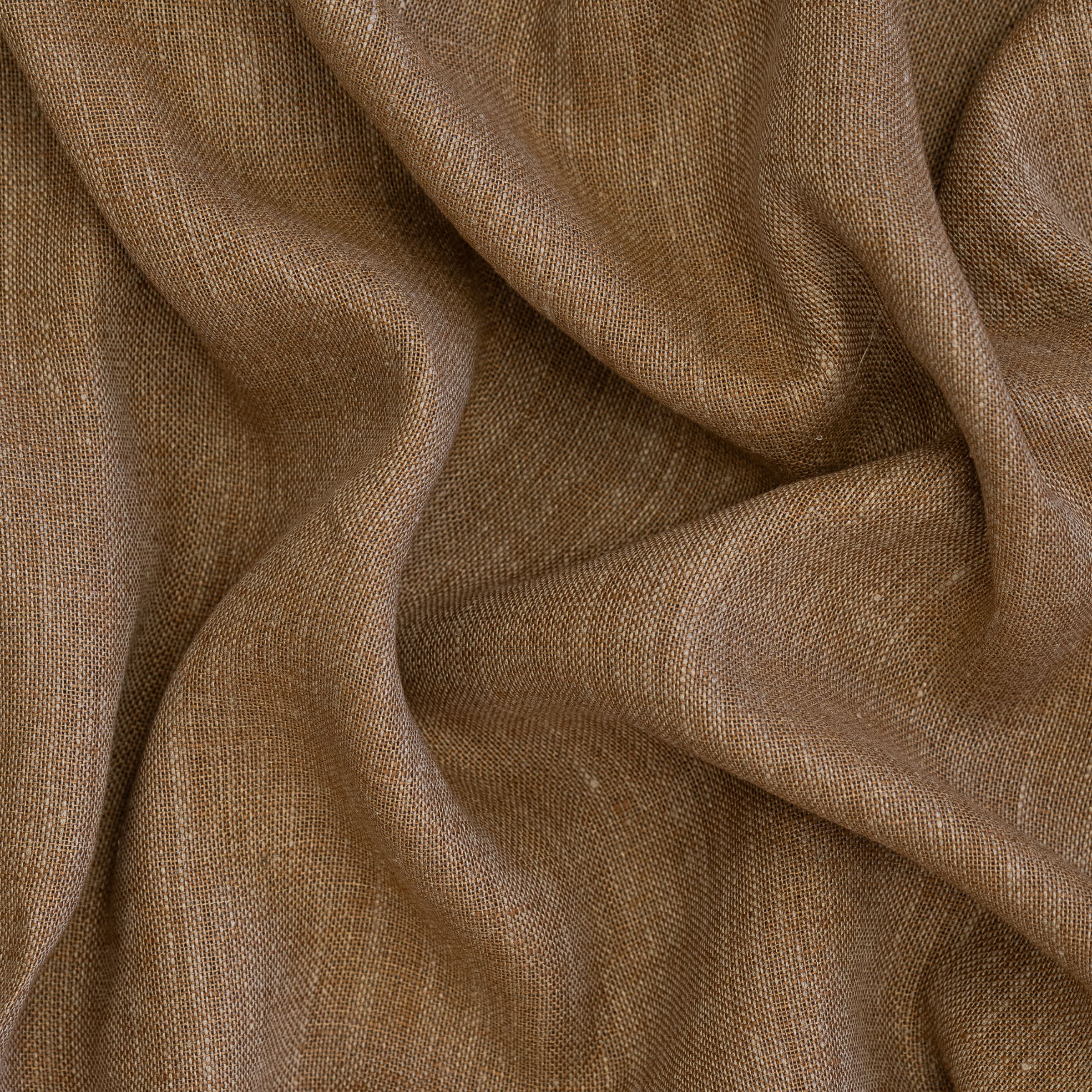 Close-up of brown fabric with visible folds