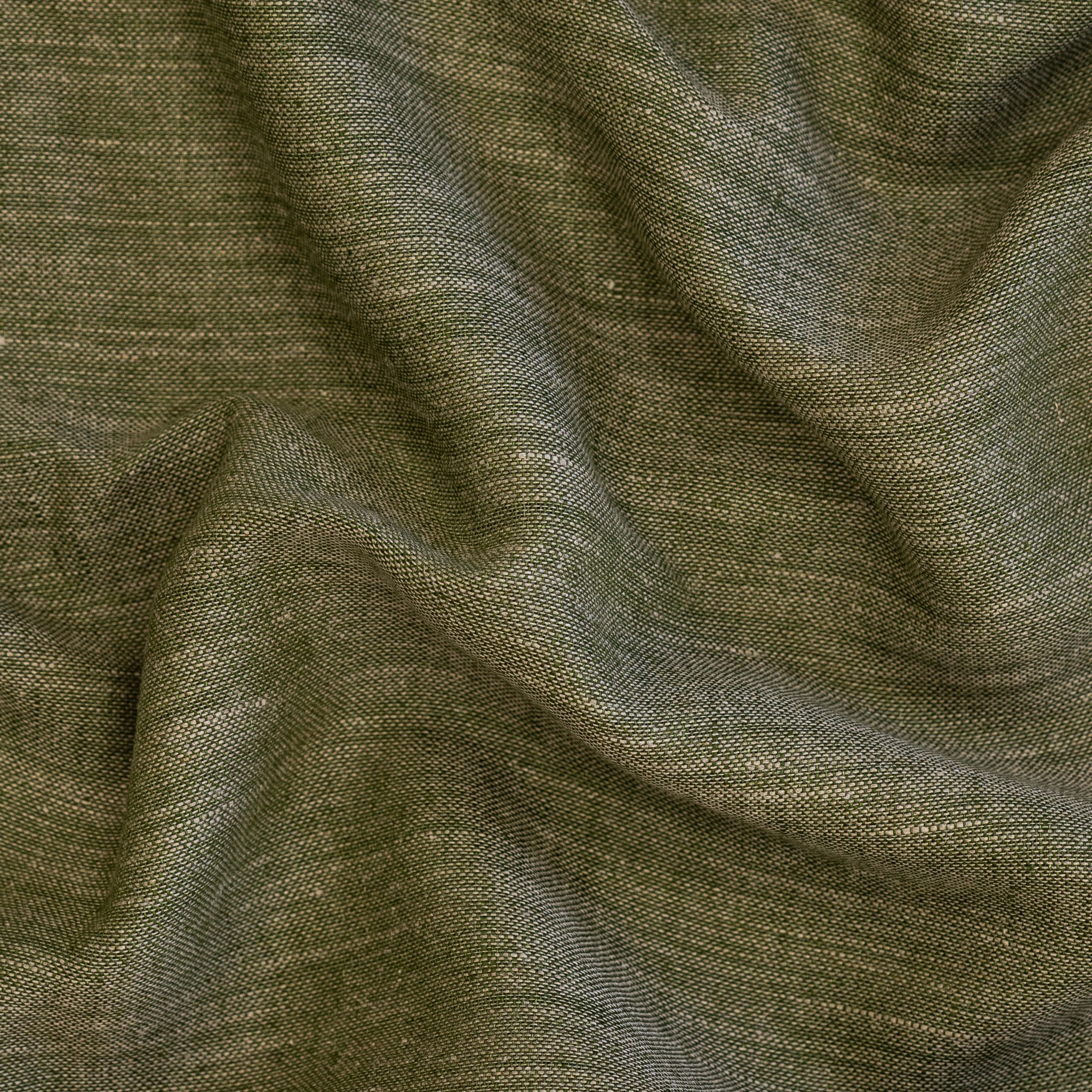 Textured green fabric with a wavy fold