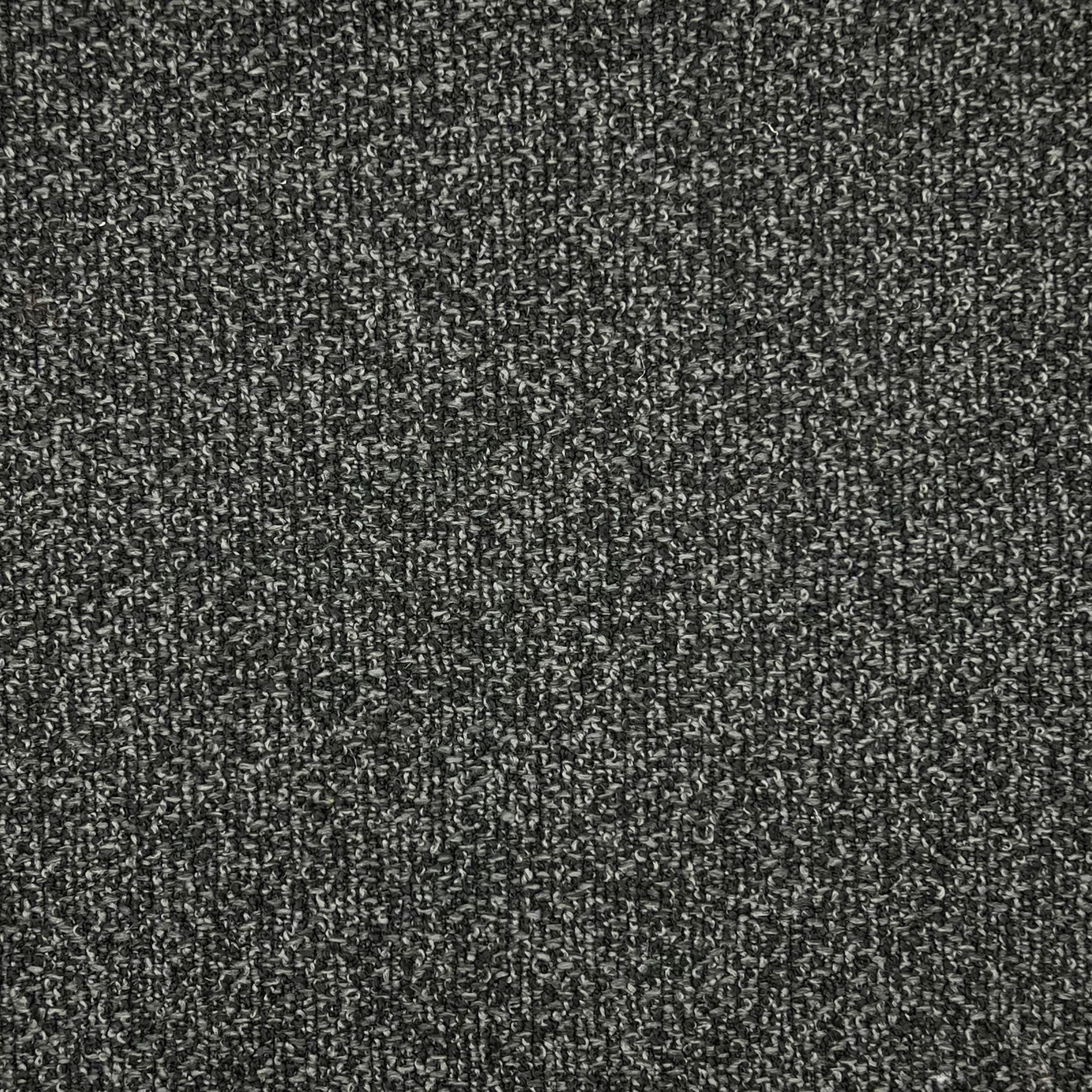 Mia is an upholstery fabric with a mottled texture with two interplaying fibers of white and dark gray, creating visual depth. 