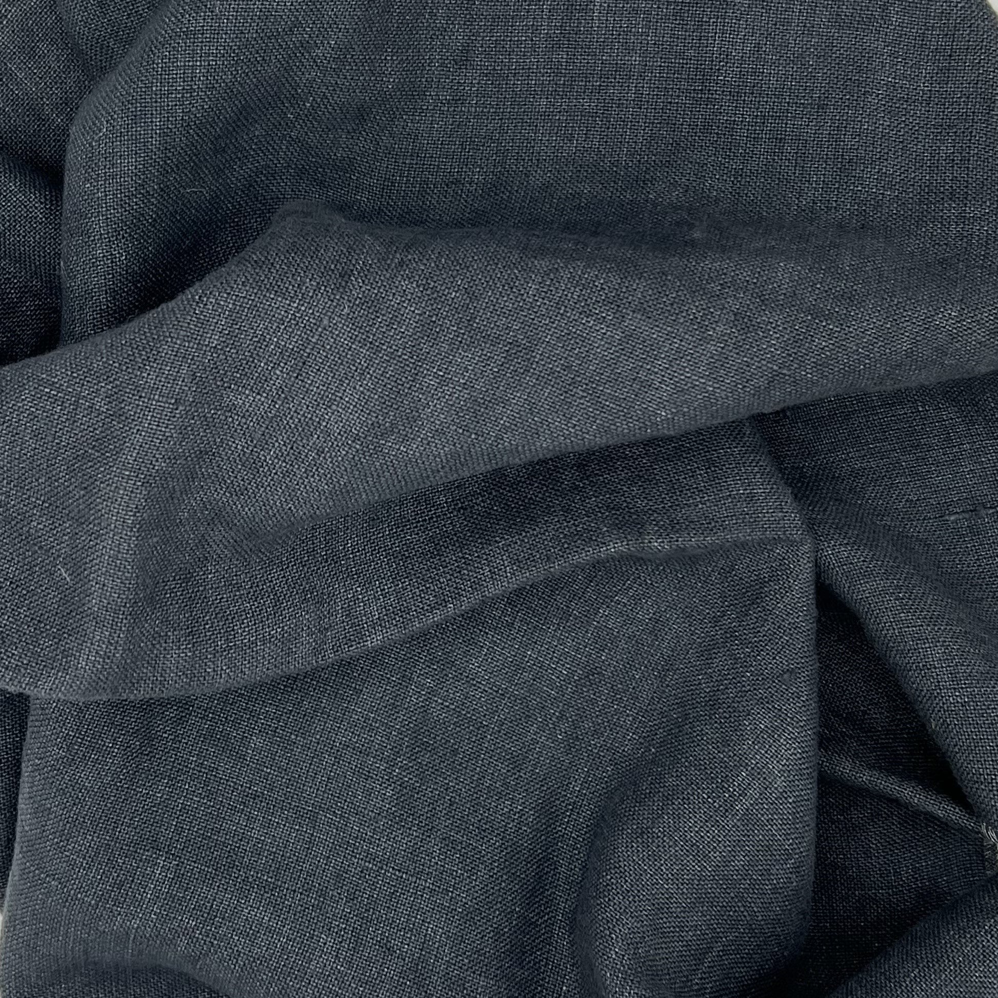 Close-up of slate gray fabric with interlaced folds