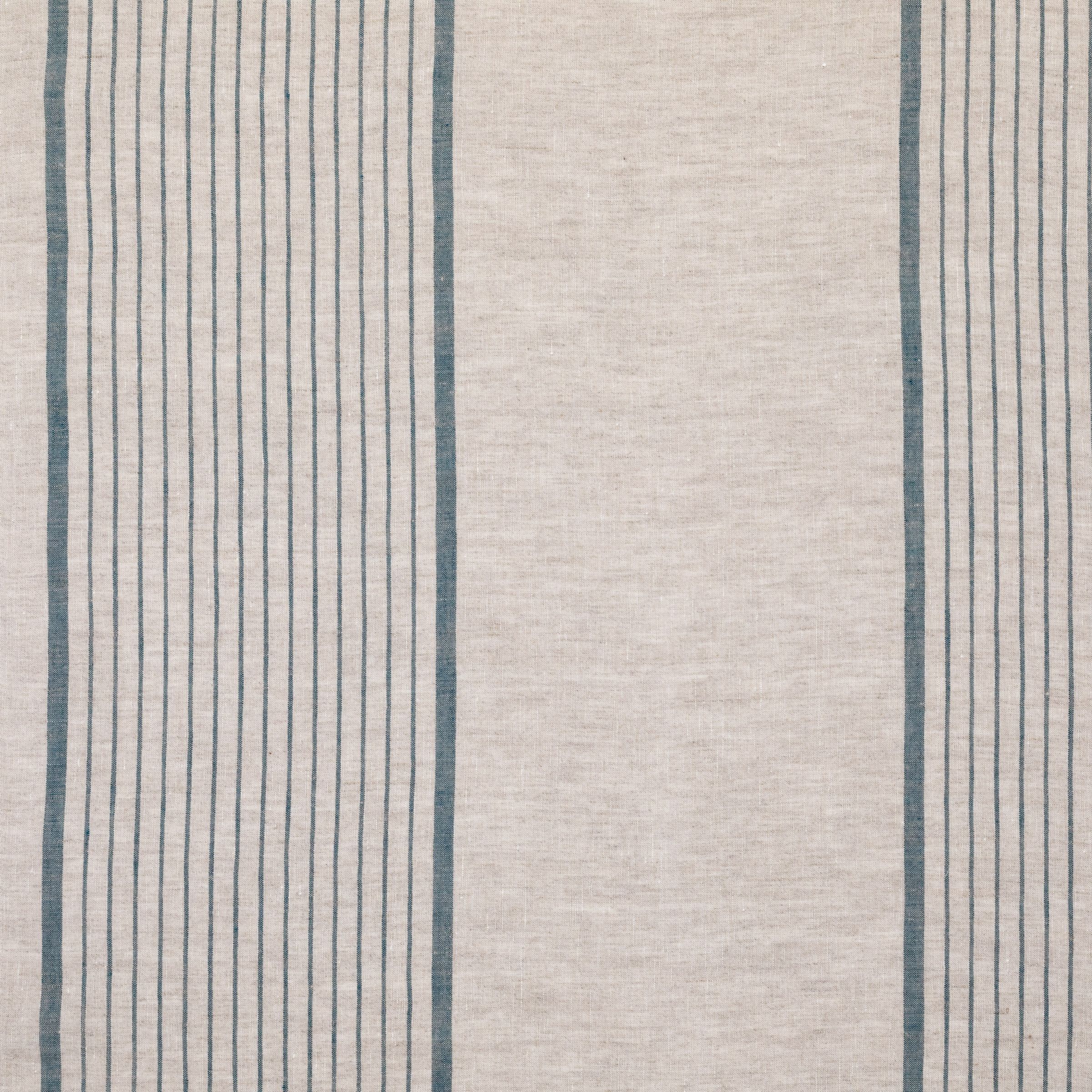 Beige fabric showing the wide, vertical blue stripes against the beige background weave.