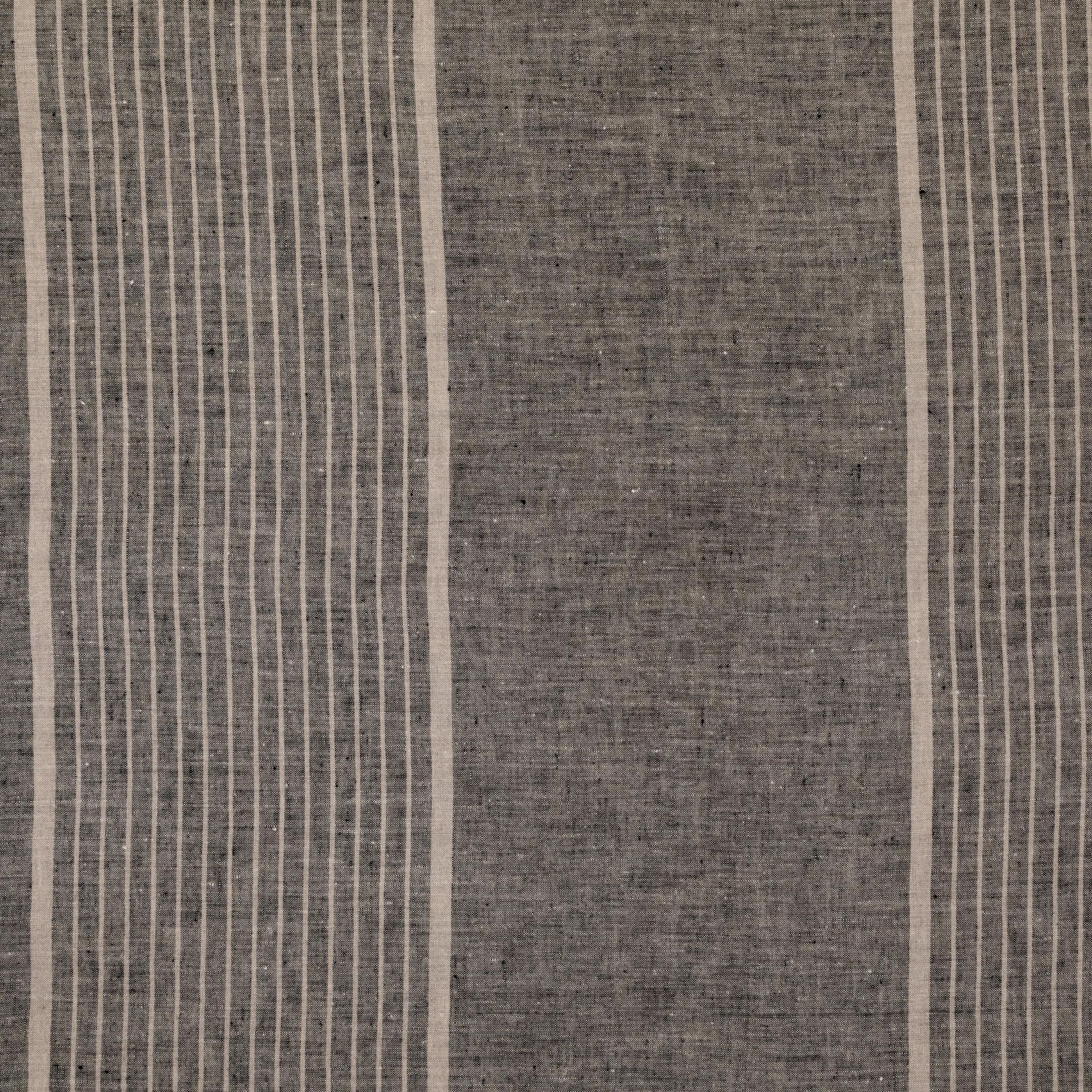 Washed dark gray fabric with varying size white vertical stripes.