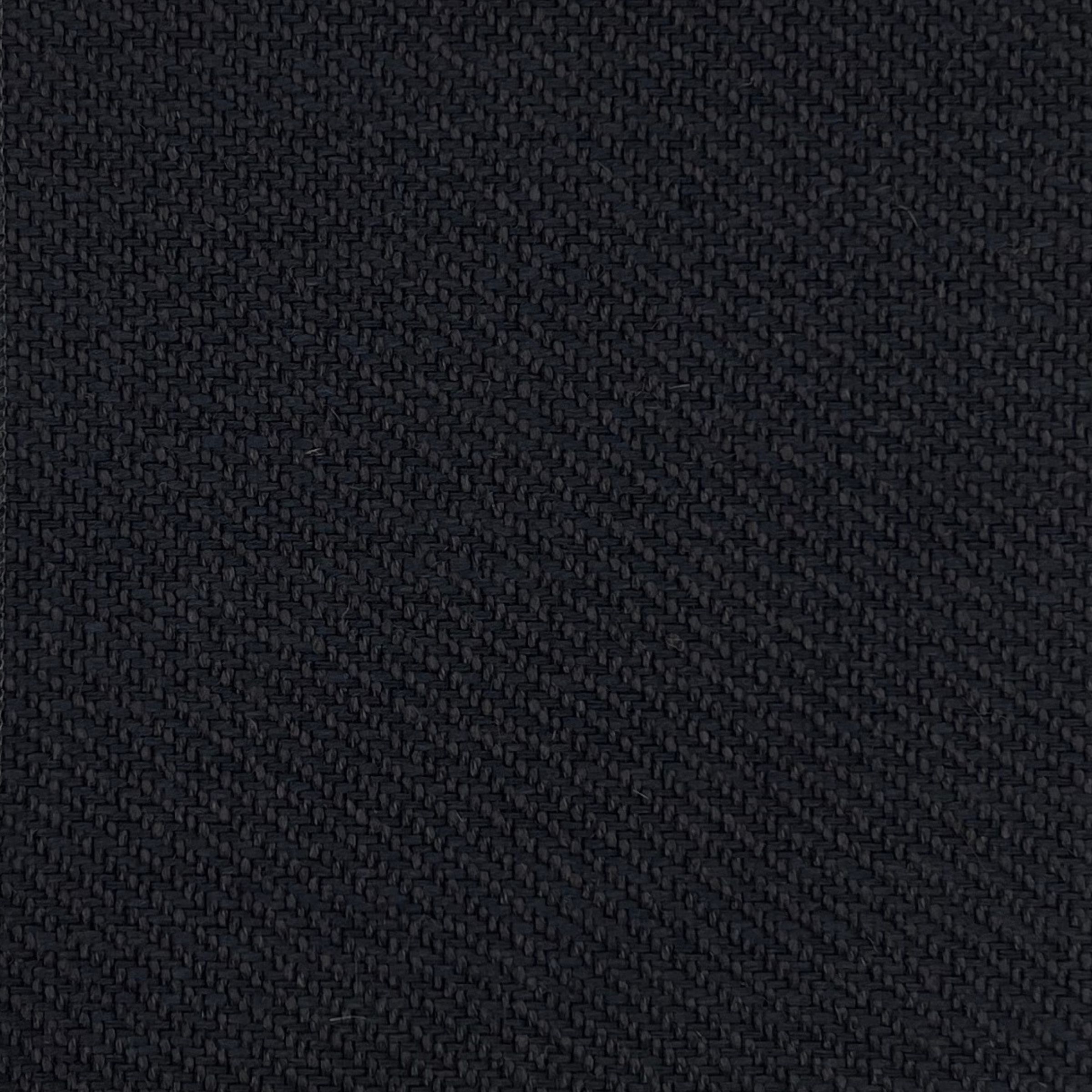 Night upholstery fabric, showcasing its fine yet pronounced texture and deep black color, creating a durable surface for funiture.