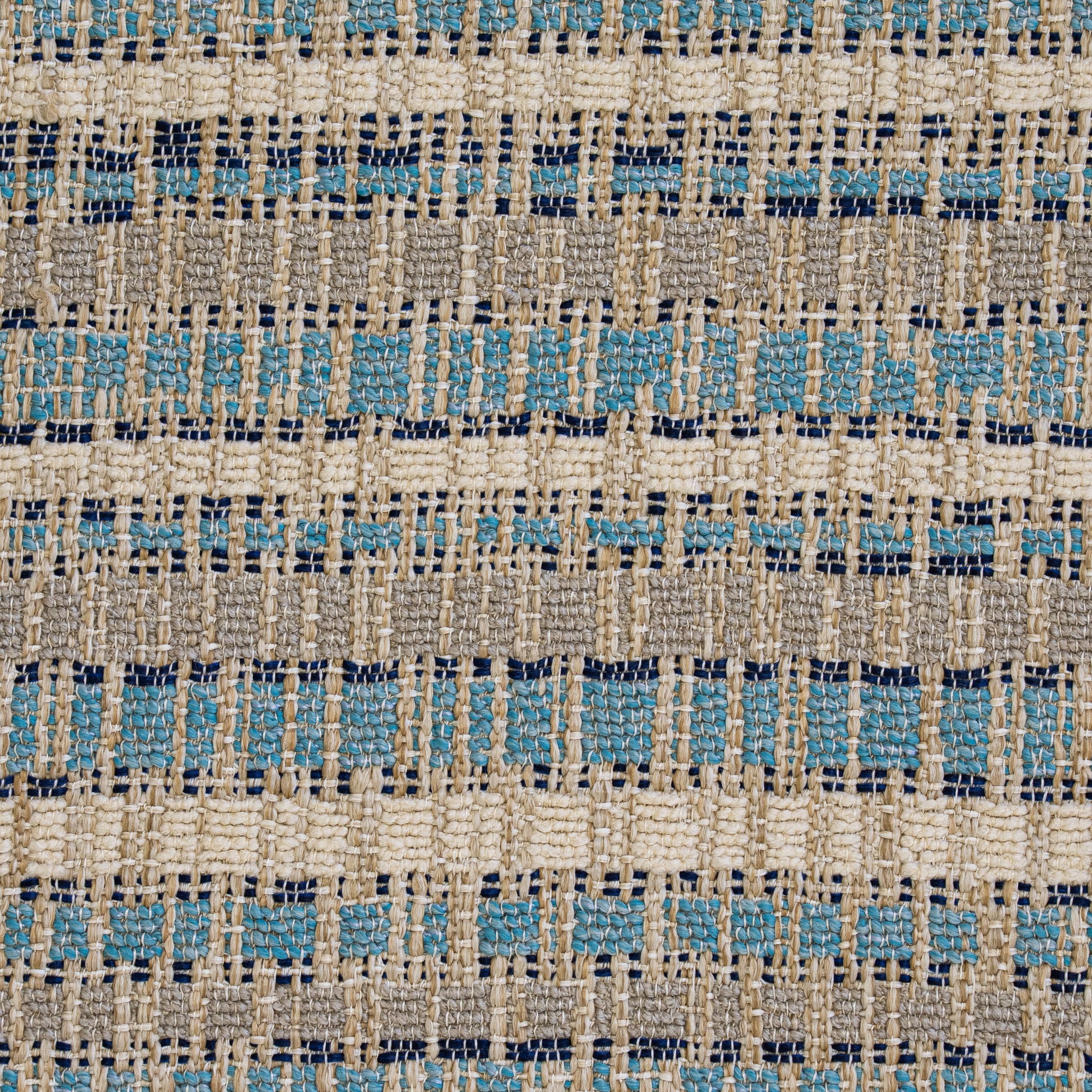 Textured upholstery with a blue and light blue pattern on a beige background.