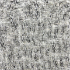 Dark gray fabric with subtle light and dark variations in the fibers, creating a textured appearance