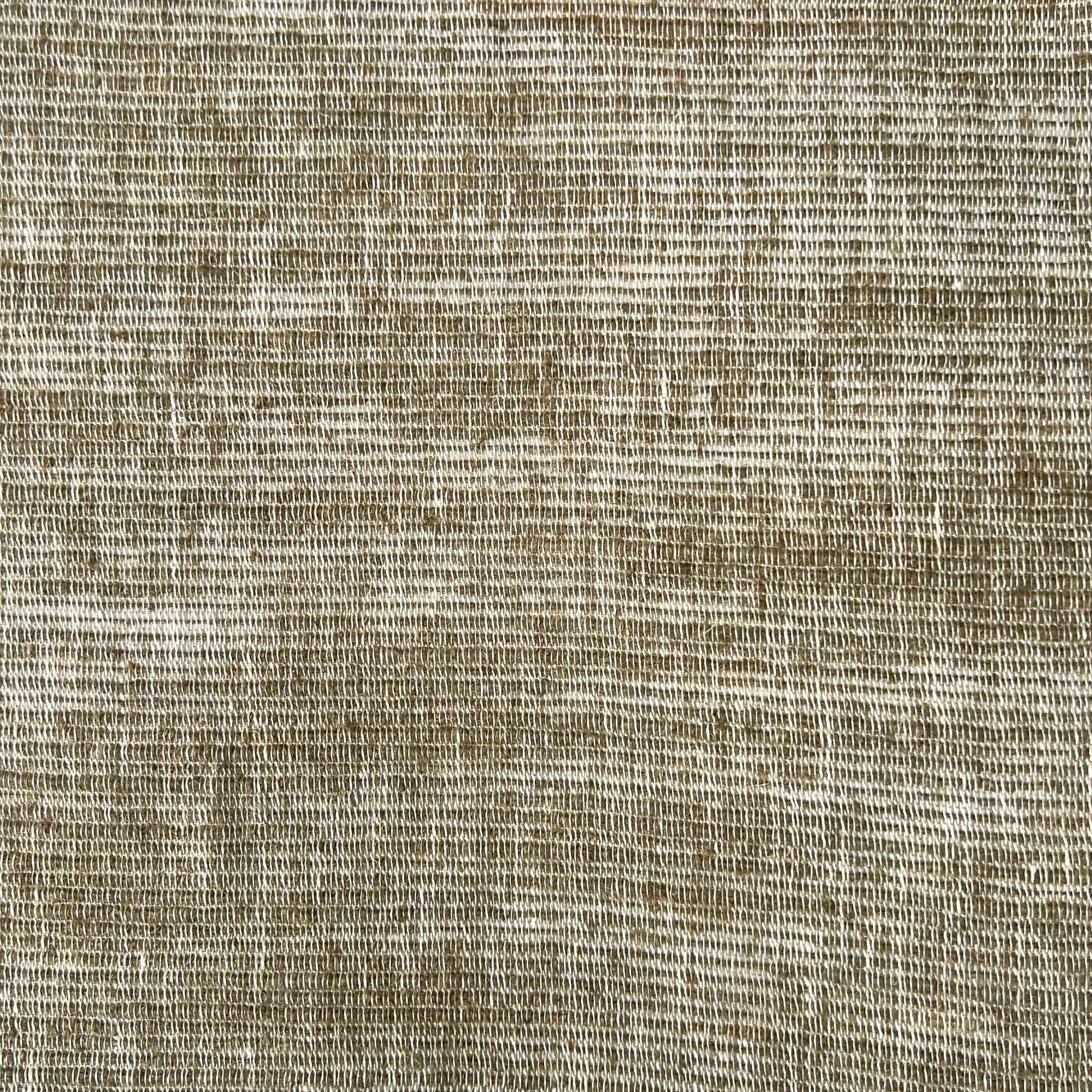 Detailed view of olive green fabric showing the interlaced threads of the weave and slight sheen variations
