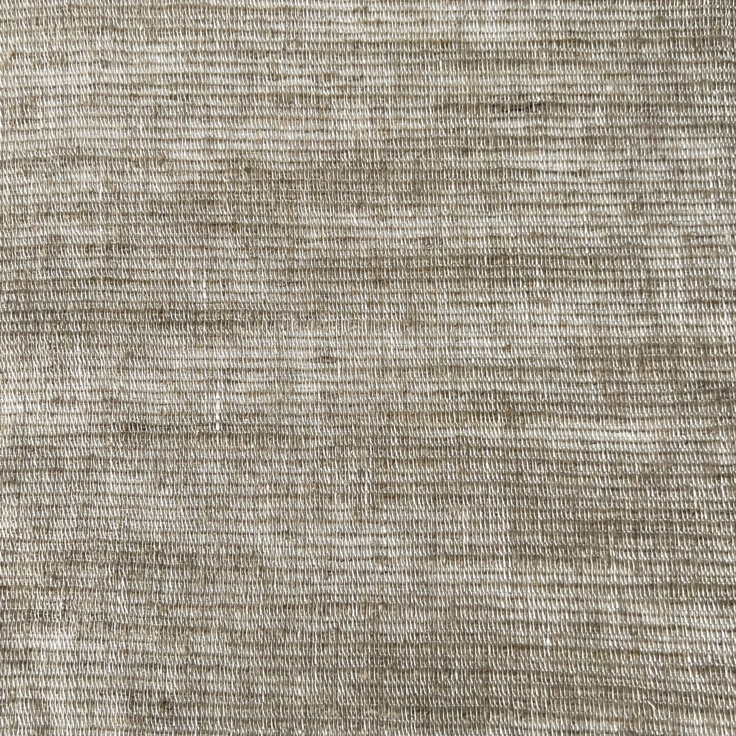 Beige-brown fabric with a fine, textured weave and subtle horizontal lines creating a slightly ribbed effect.