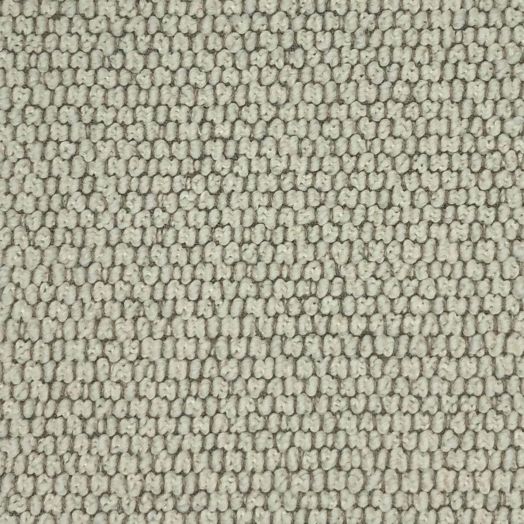 Cream fabric with small, tightly packed loops creating a textured surface