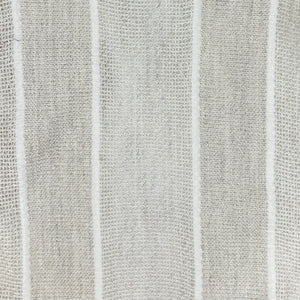 Close-up of light gray fabric showing a loose plain weave and prominent, medium-width textured white vertical stripes.