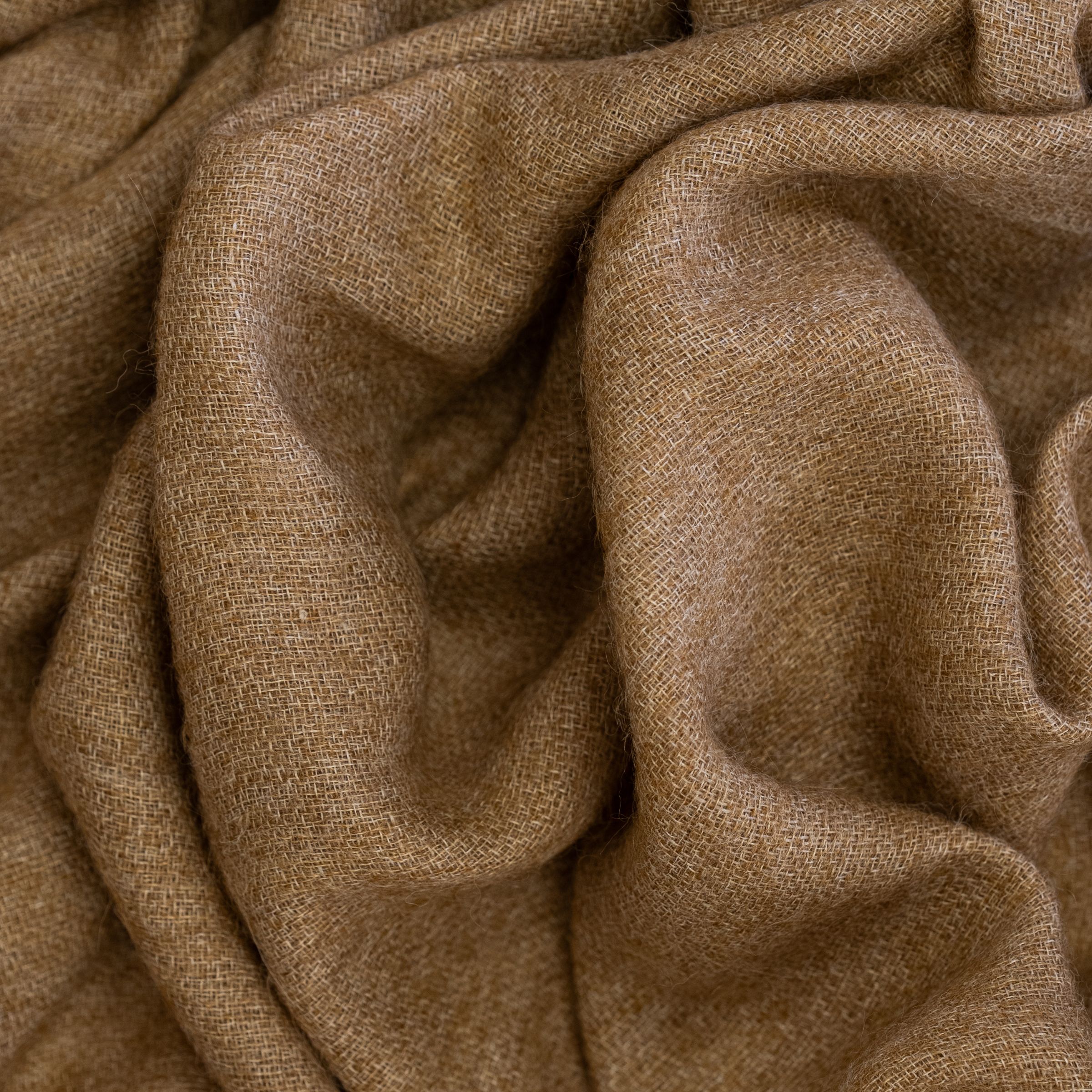 Close-up of Cinnamon brown fabric with large wavy folds