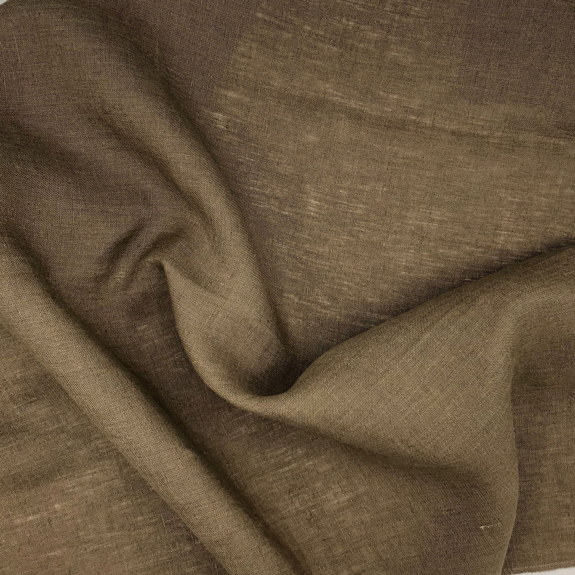 Close-up of brown fabric with wavy folds