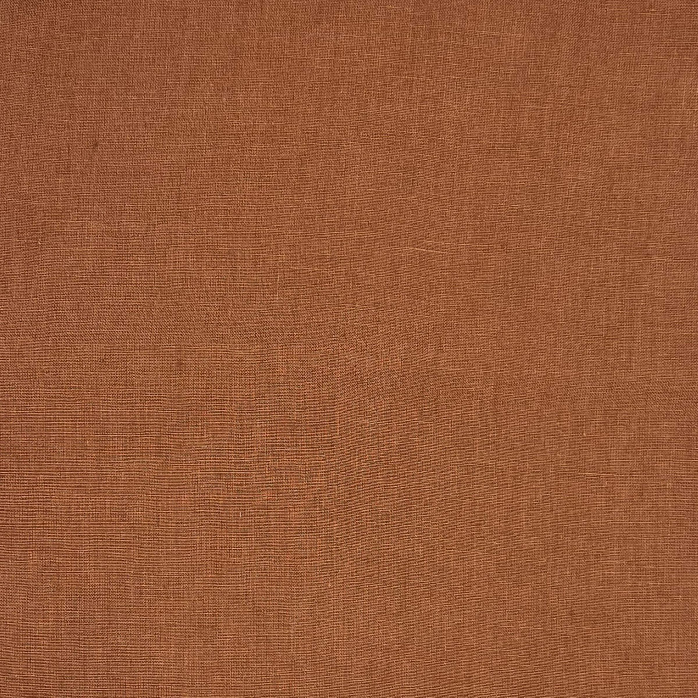 A orange-brown fabric with a consistent surface and subtle woven texture.