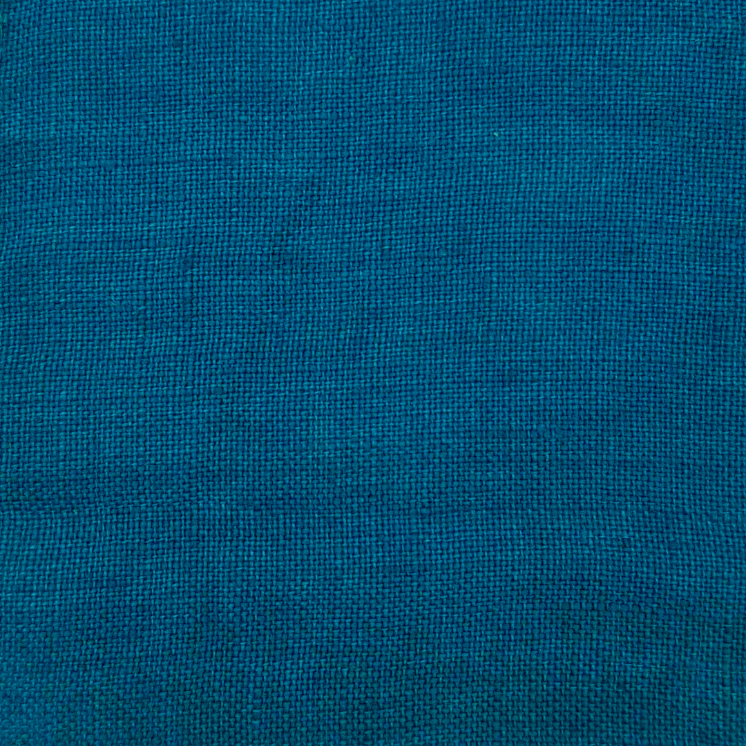 Denim blue fabric with a visible plain weave and a matte finish.
