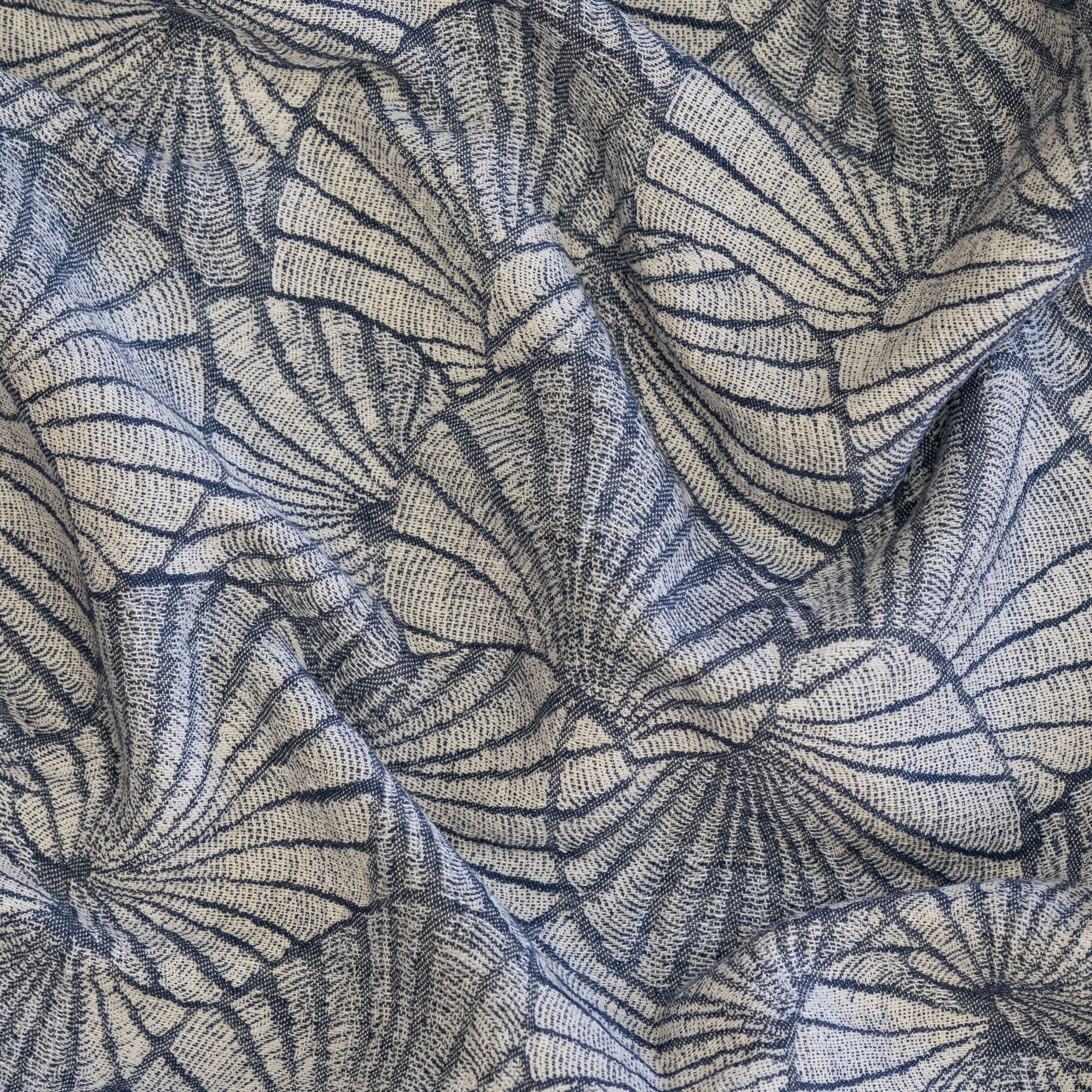Patterned fabric boasting a shell design in blue and gray with scrunched folds 