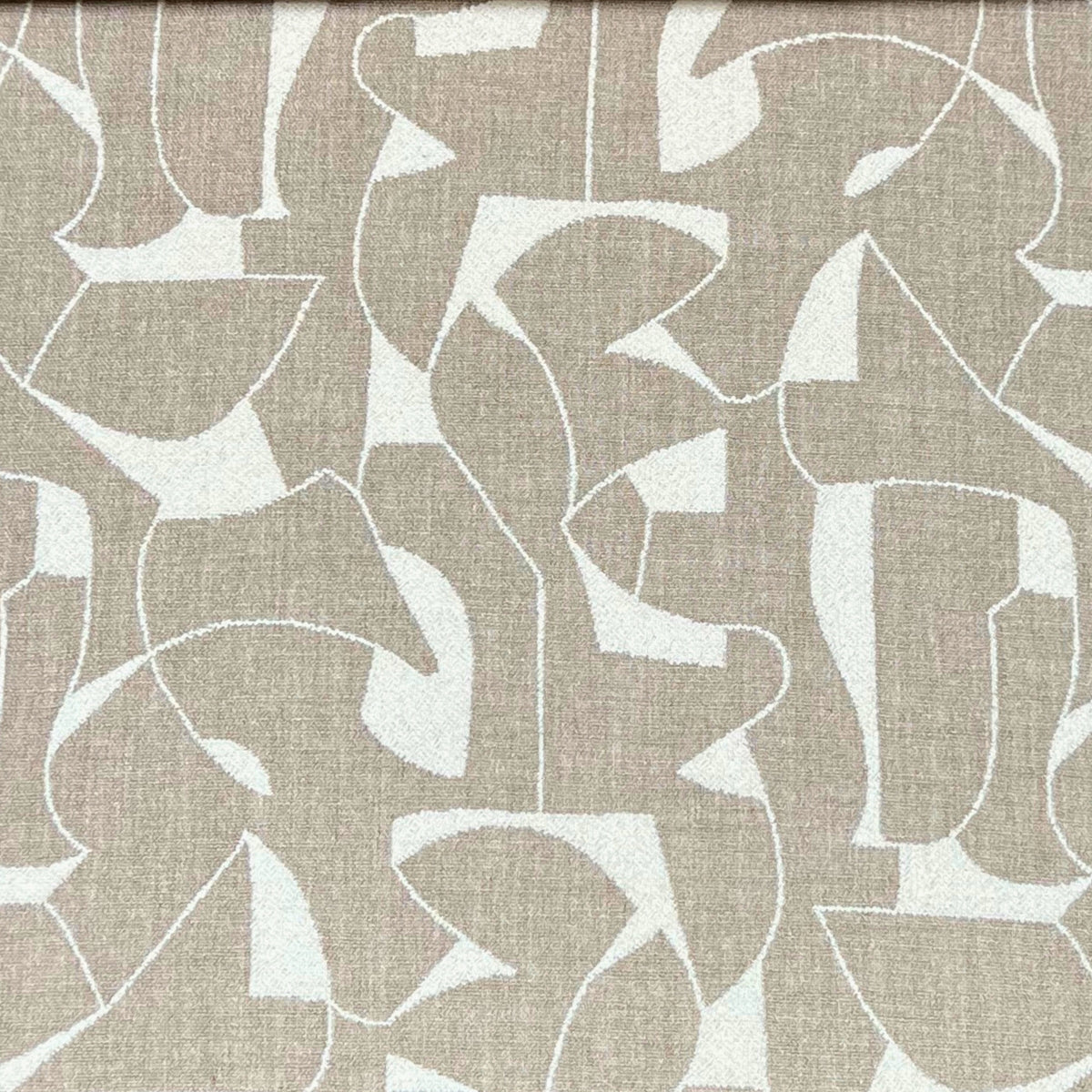 Cream-colored upholstery fabric with a textured, geometric pattern of interlocking shapes, reminiscent of abstract art.