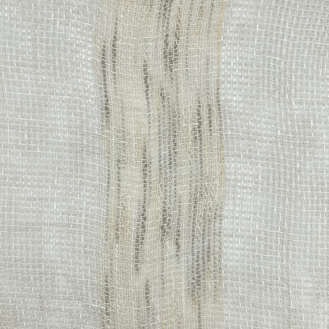 Close-up of off-white fabric showing distinct vertical areas of varying weave density, creating a subtle gray stripes.