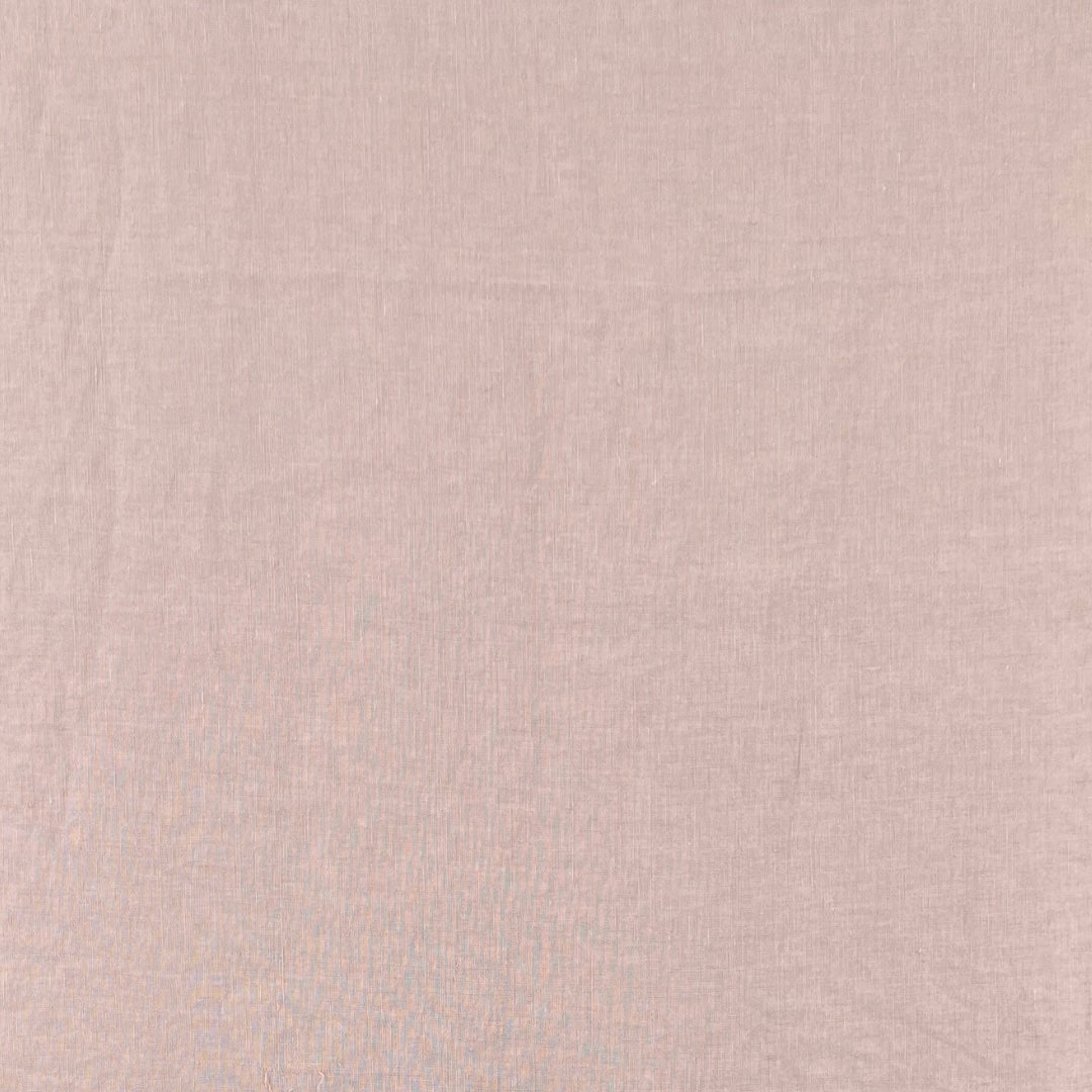 Light pink fabric with a fine, even plain weave.
