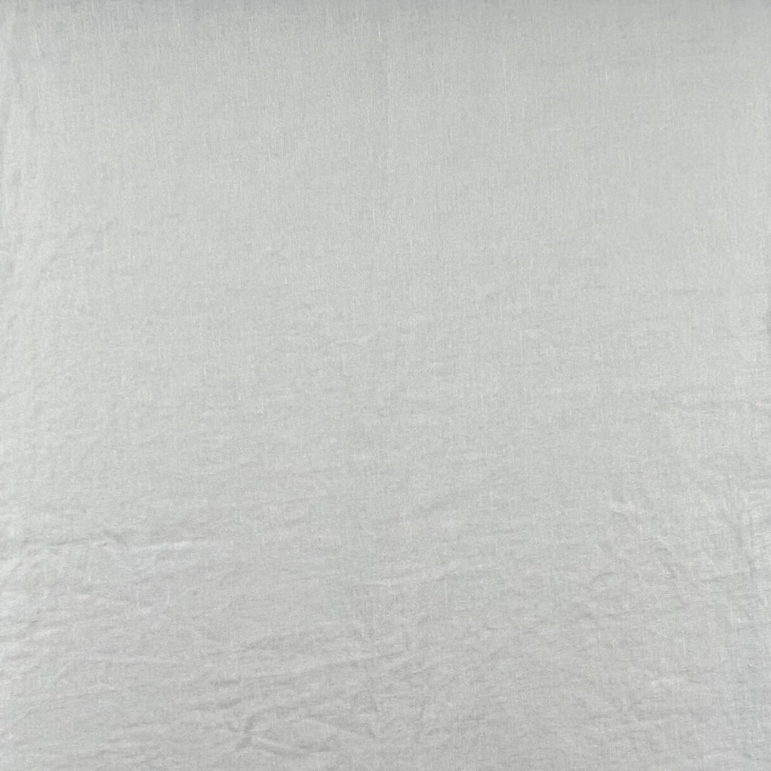 Off-white fabric with a smooth weave and matte sheen.