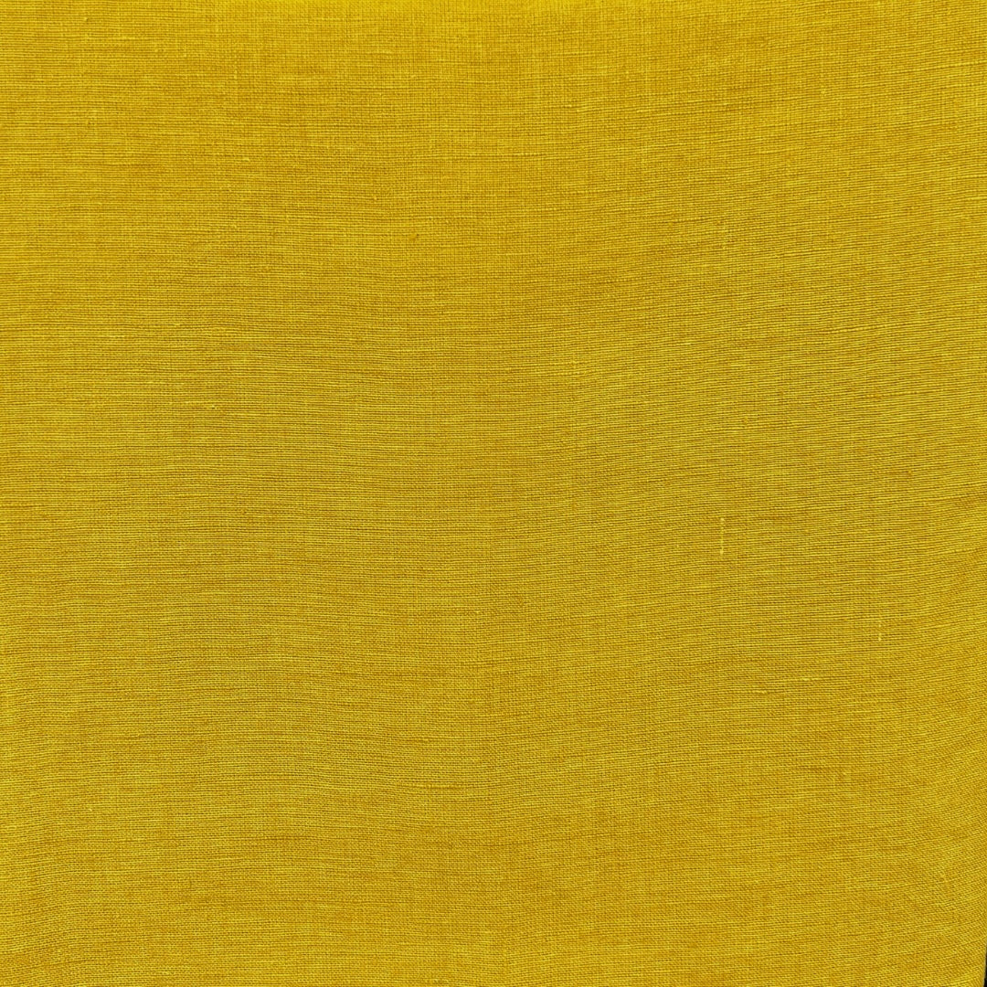 Yellow fabric with a tight, even plain weave.