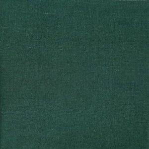 Close-up of dark green fabric highlighting the even texture and color.